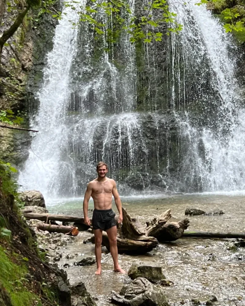 Nils Enders-Brenner outside at a waterfall in Bavaria